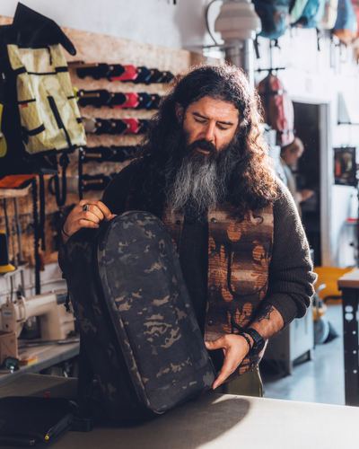 Brown Buffalo, the founder, wearing backpacks Military-Grade Durability